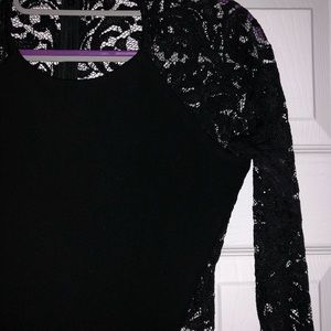 Form-fitted little black mini dress with lace